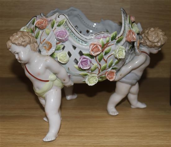 A ceramic table centre with putti decoration